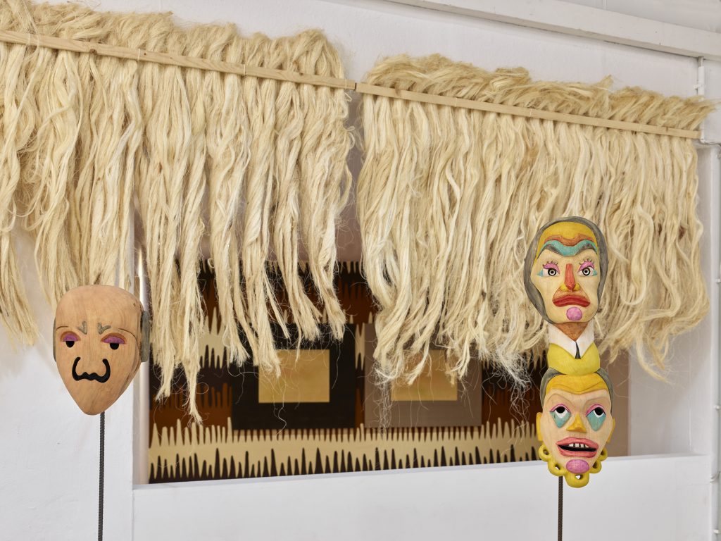 Mauricio Limon Mexican colorful wooden masks in the exhibition at wildpalms 2019