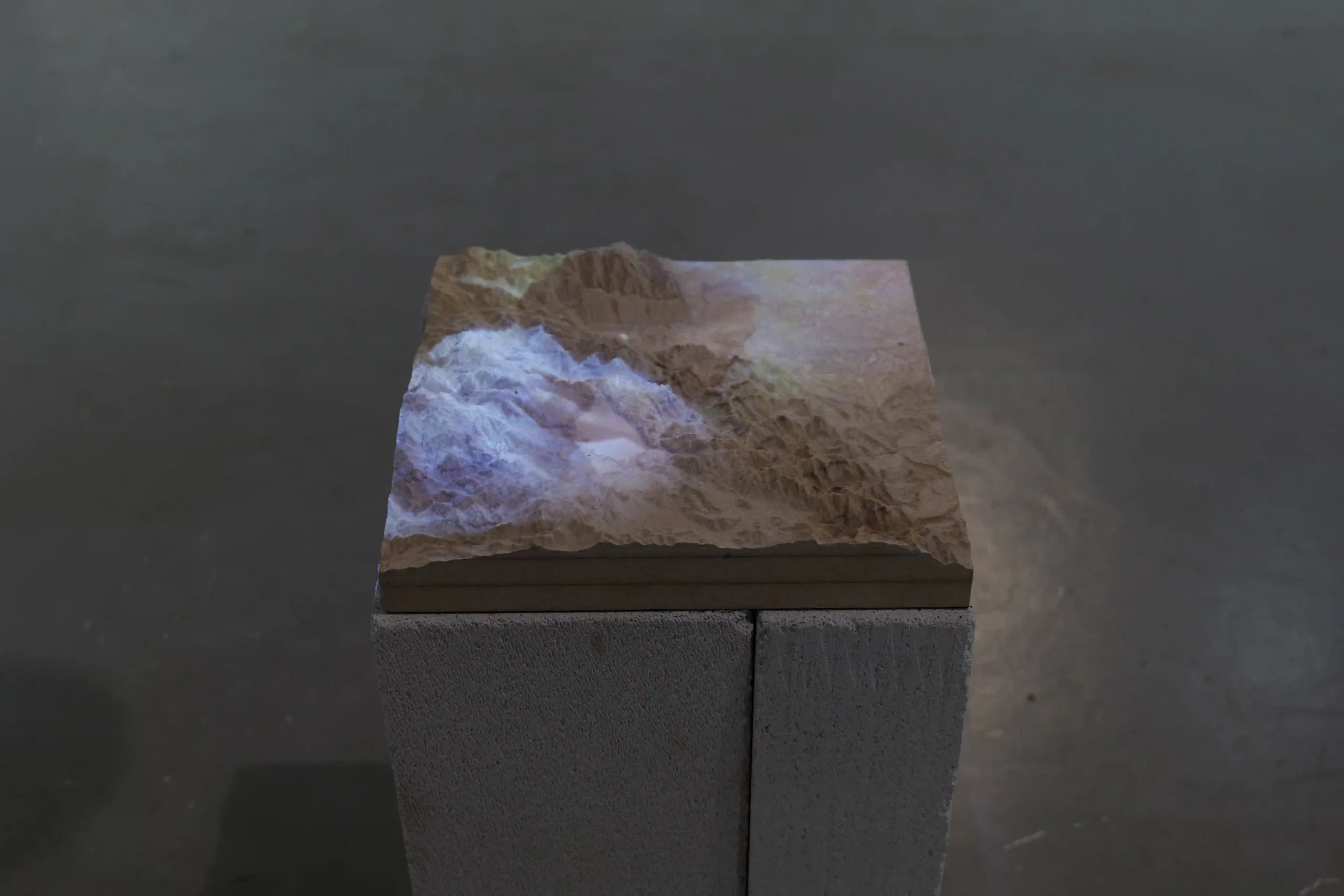 Felipe Castelblanco installation with a projected landscape model in To Produce the Sound of Falling Stones