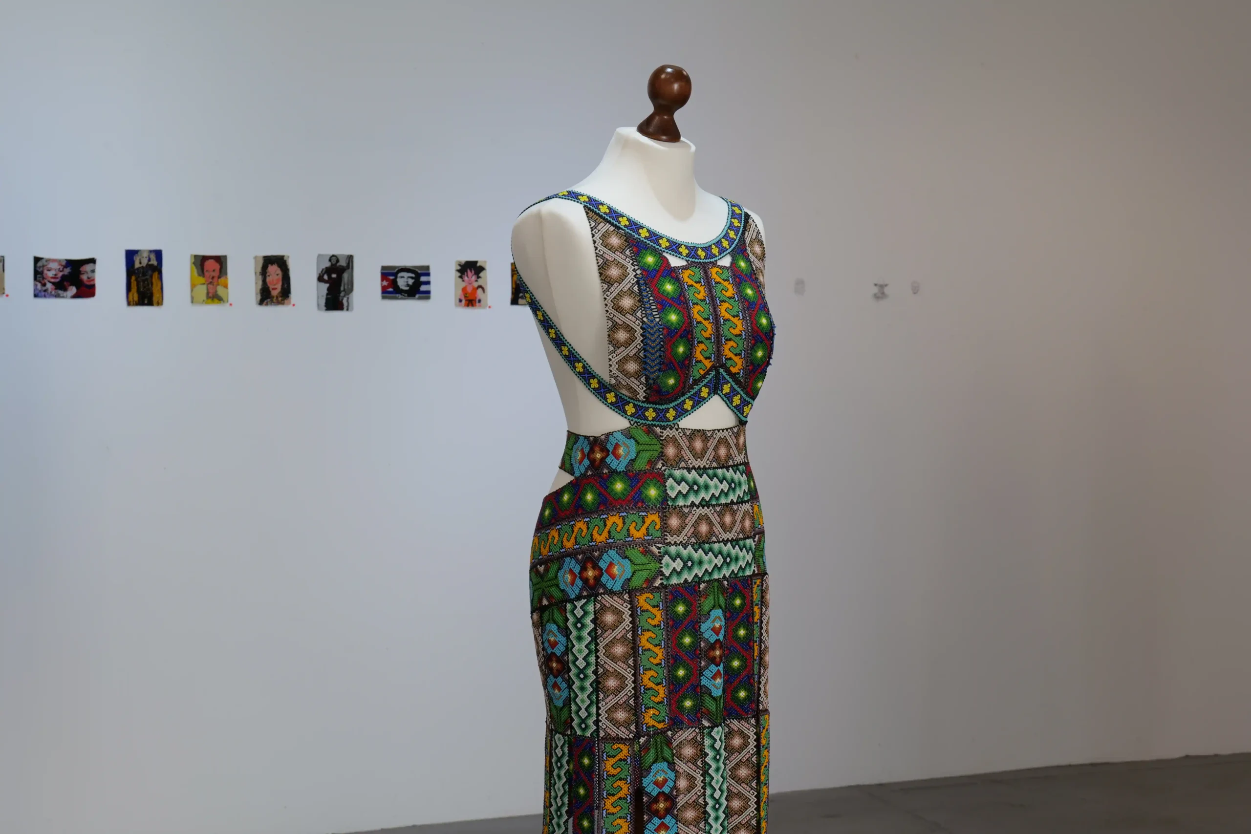 Exhibition view of textile works on mannequins in the Wild Palms gallery