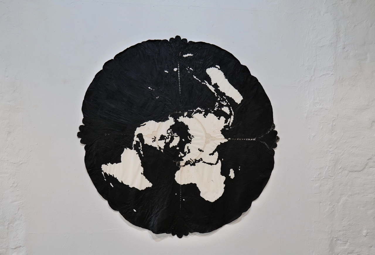 Roberto Uribe Castro exhibition view with black sculptural forms