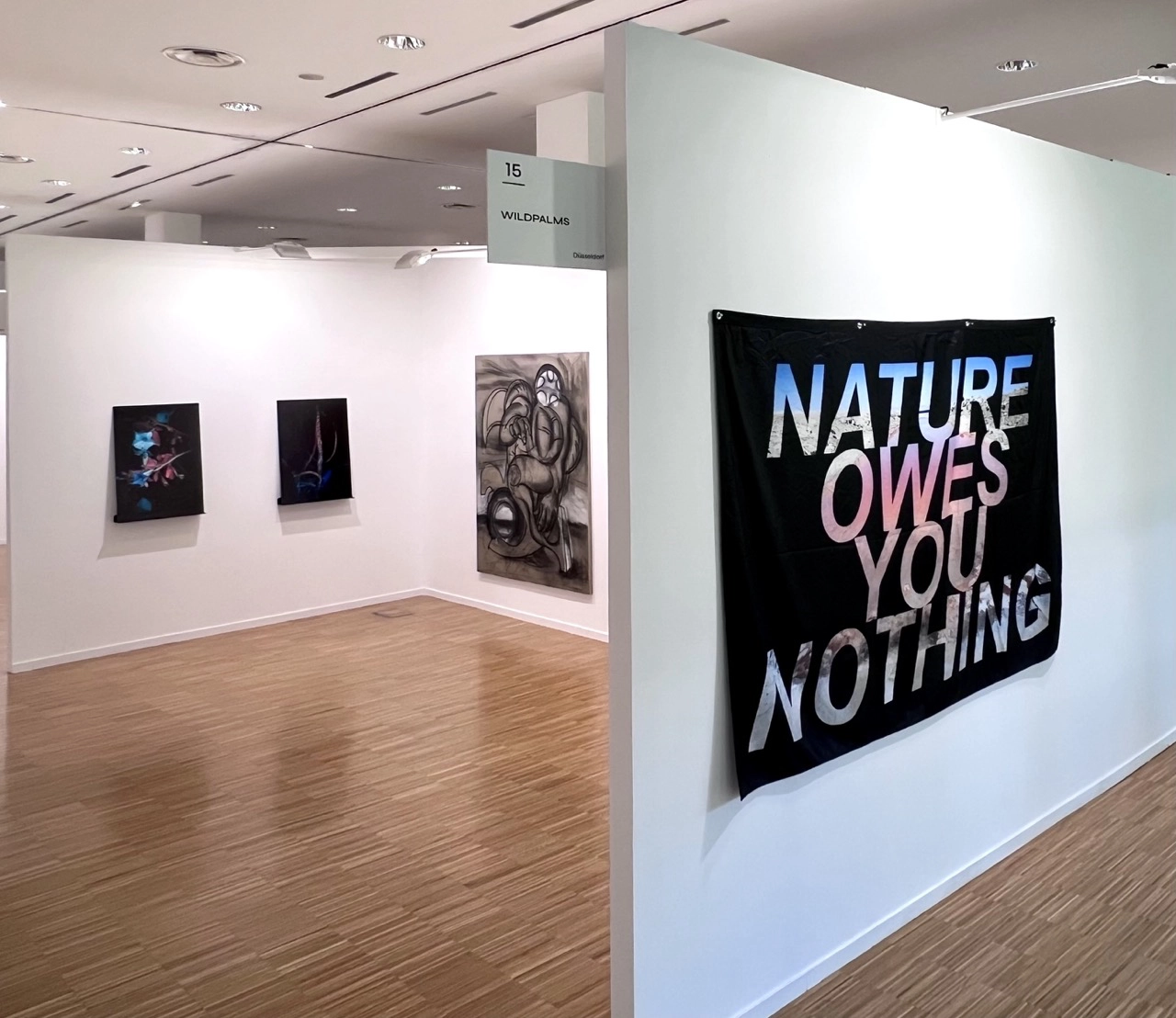 Wildpalms booth 15 at ArteSantander 2025 with Nature Owes You Nothing textile work and framed artworks