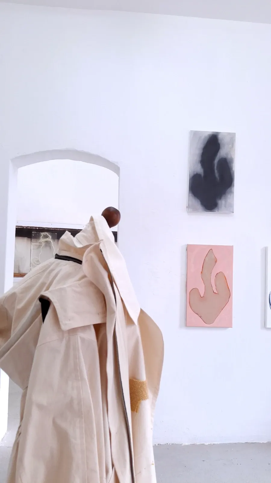 Angelika Kammann, garment sculpture, with paintings by Christian Seybold in the background. Practices of Moving, curated by Alexandra Meffert and Jorge Sanguino.