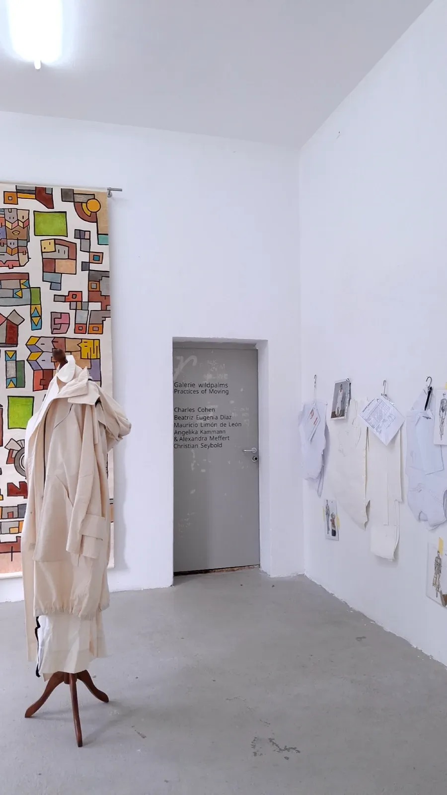 Installation view of Practices of Moving with the entrance wall text and works by Mauricio Limón de León and Angelika Kammann. Curated by Alexandra Meffert and Jorge Sanguino.