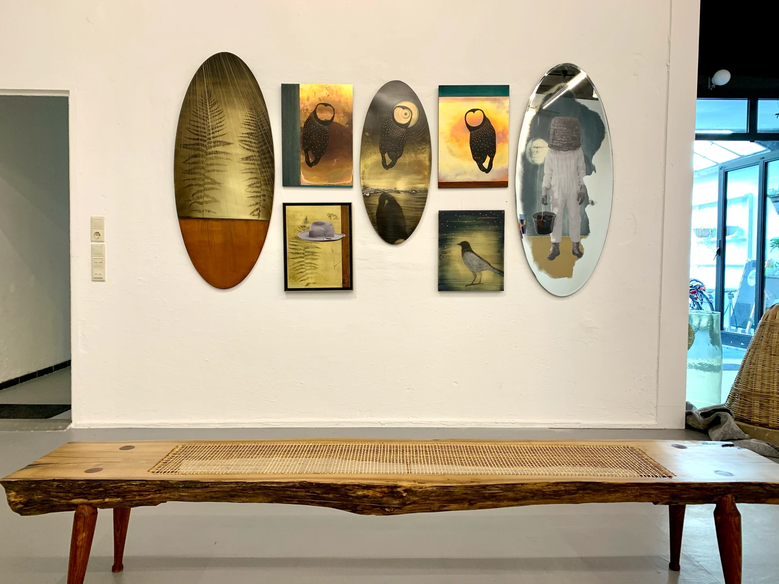 Bird paintings, mirror piece and wood cane bench by Robert Elfgen, Passage exhibition at wildpalms Düsseldorf, curated by Jorge Sanguino
